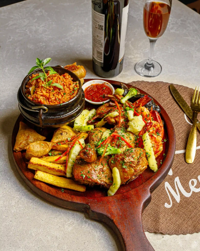 Smoky party jollof rice with grilled chicken at Nest Lagos restaurant, Lagos
